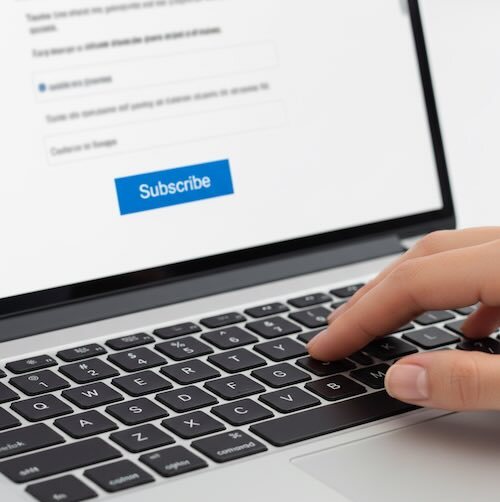 person about to click subscribe button